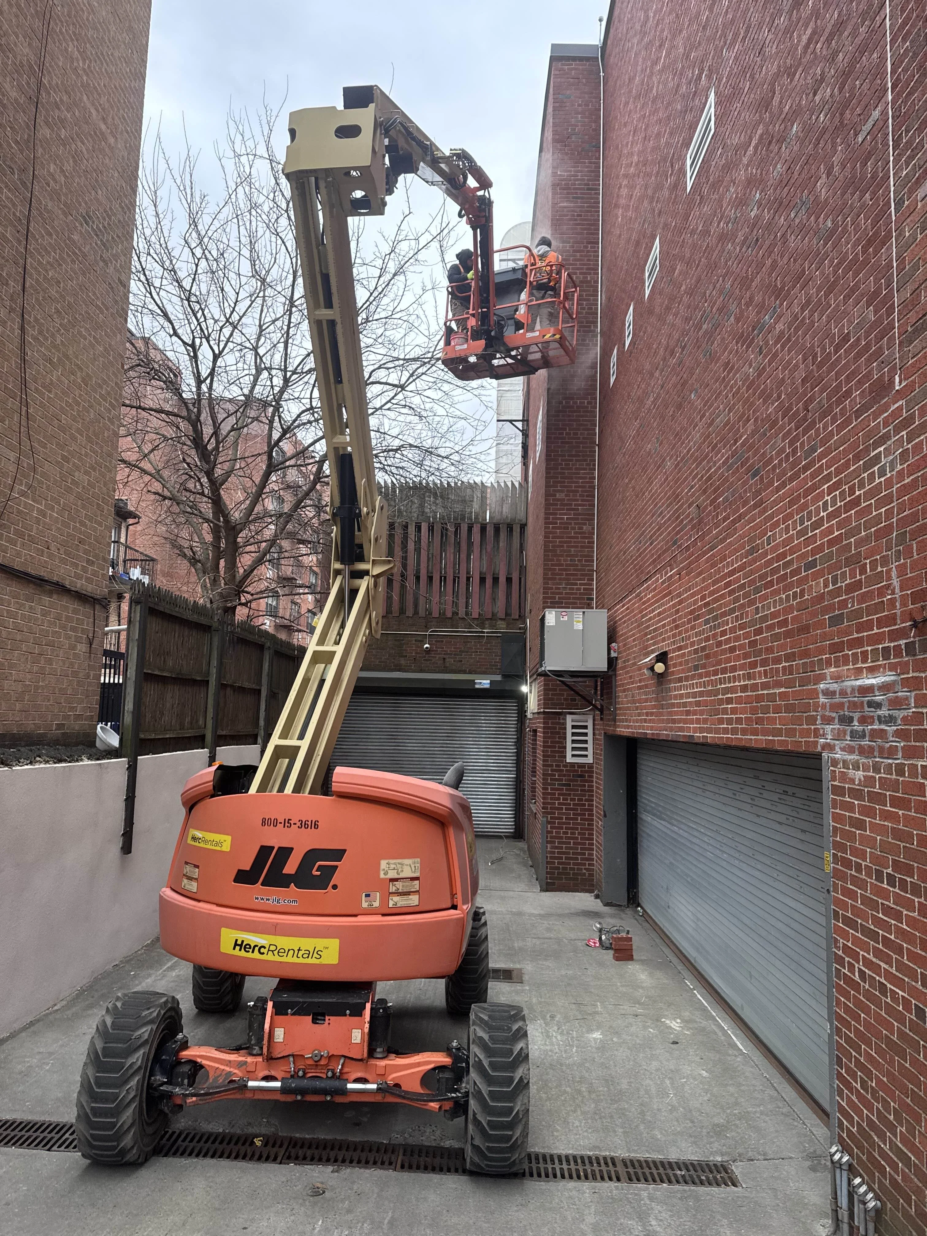 Brick pointing with boom lift in New York City