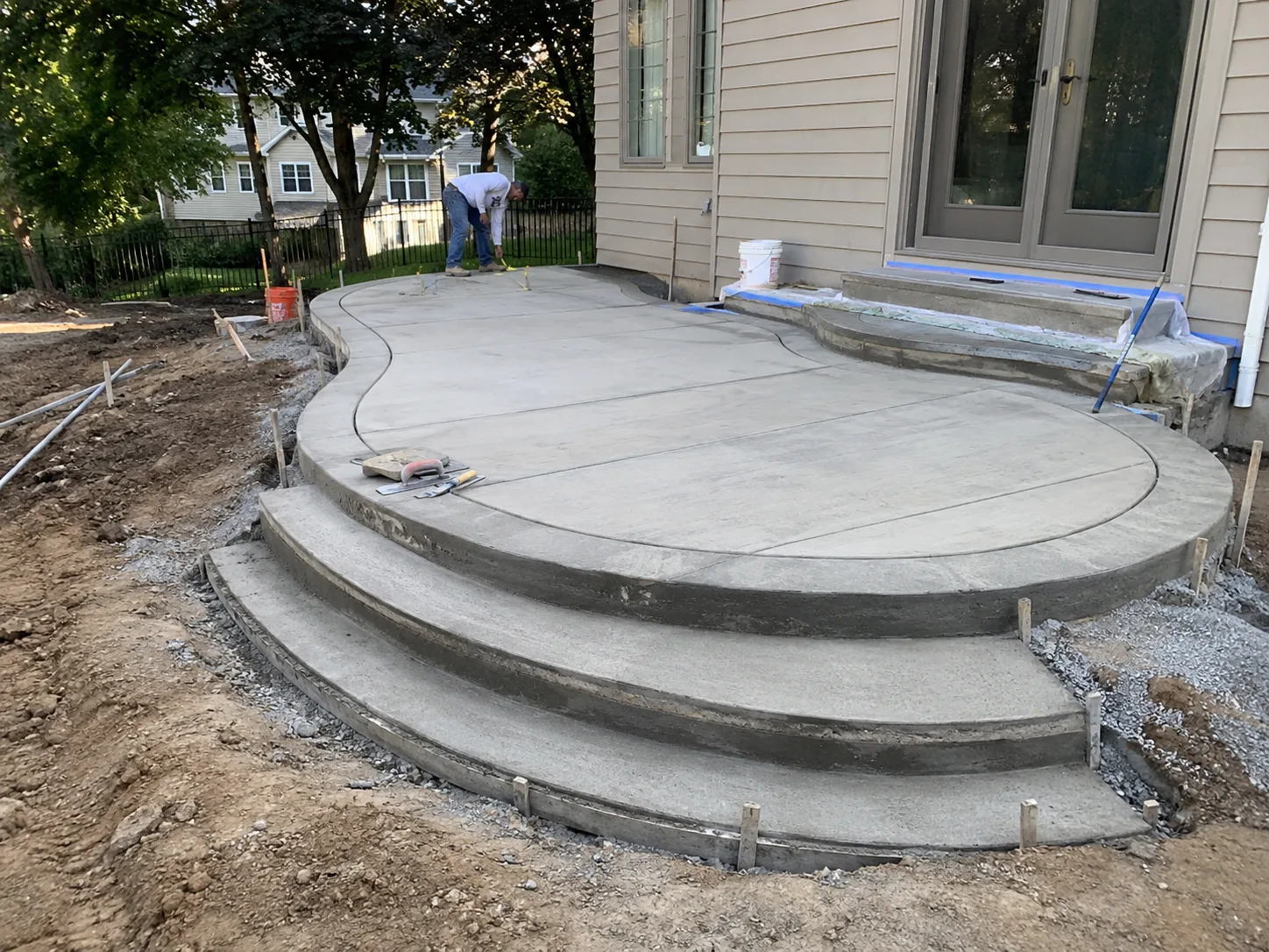 Custom curved concrete patio with rounded steps