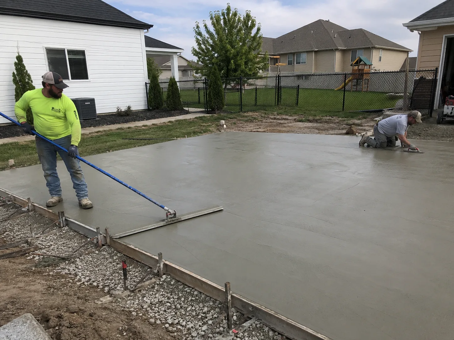 Precision Concrete crew finishing a large concrete slab